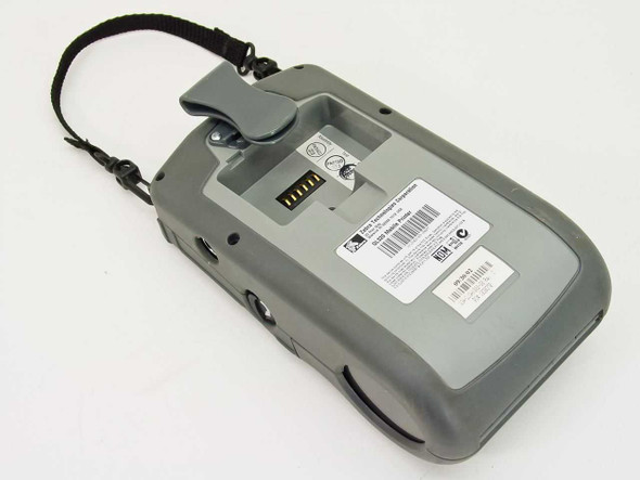 Zebra QL320-RF mobile printer rear view showing battery contact port and compliance label