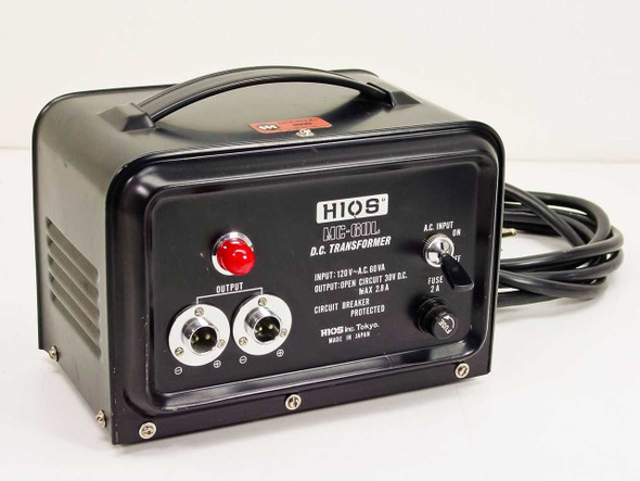 HIOS MC-60L DC Transformer front panel view showing output jacks, red pilot light, AC input switch, and rating label reading 120V AC 60VA input, 30VDC open circuit 2.8A output, circuit breaker protected