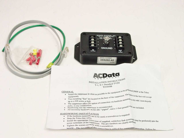 AC Data Systems TJ1010B T1 E1 TVSS surge suppressor shown with included installation instructions, ground cable, RJ-48C patch cable, and wire terminal hardware