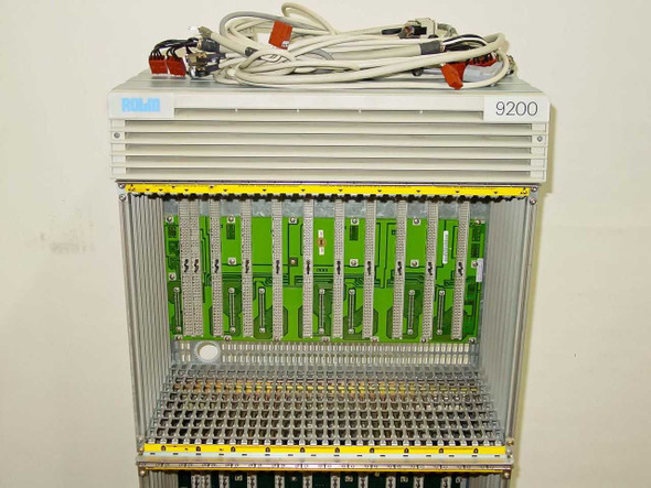 Rolm 9200 PBX chassis – close-up of top shelf bay showing green circuit boards installed and dense backplane connector strip
