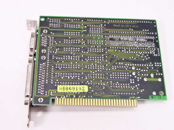 Diamond IO DIO-100 Rev C ISA card — solder side with yellow asset tag B069192 visible, DB25 and DB9 connectors visible at left edge