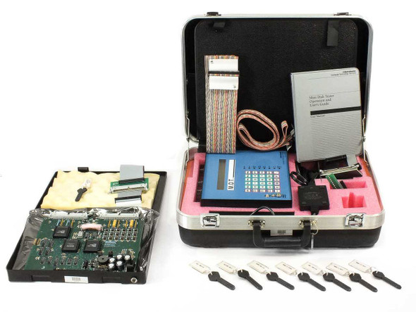 Bell Atlantic MDT Portable MFM Hard Drive Tester full kit — open hard shell case showing MDT unit, ROM keys, ribbon cable, power adapter, manual, and expansion PCB in separate foam-lined case