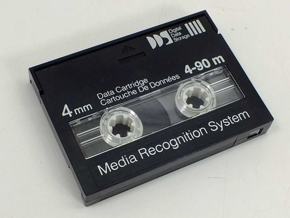 DDS 4mm Data Cartridge 4-90m removed from case, front label clearly showing Digital Data Storage logo, 4mm, 4-90m, and Media Recognition System text