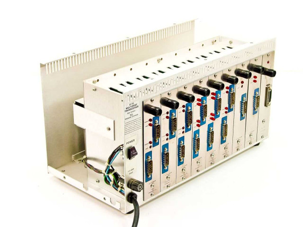 TCL 2110 Multiport Transceiver chassis angled front-right view showing 9 installed cards with DB25 connectors and LED indicators