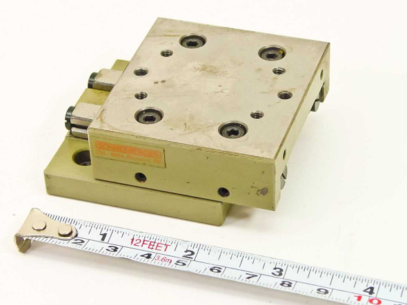 Schneeberger Rondal RF linear positioning table slide — top and front view with tape measure showing approximately 2.375 in platform width