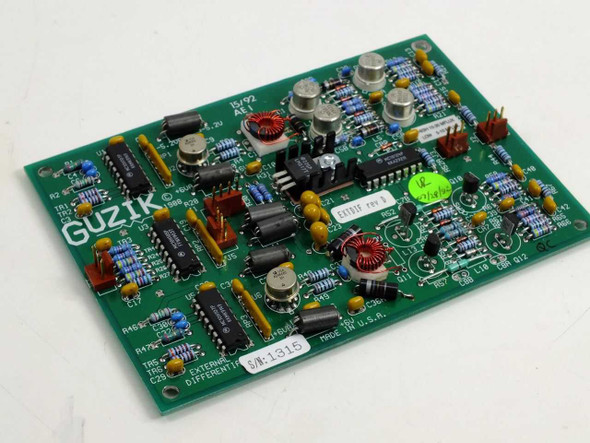 Guzik 300663 External Differential AEI PCB front view showing full component side with ICs, inductors, and capacitors