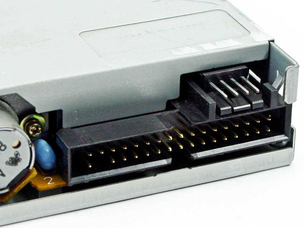Mitsumi D359M3 floppy drive rear connector close-up showing 34-pin IDC data ribbon connector and 4-pin power connector interface