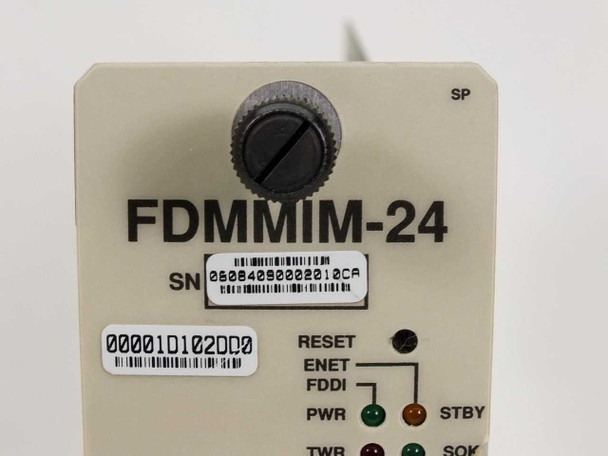 Cabletron FDMMIM-24 front panel close-up – model label, serial number barcode, asset tag, reset knob, and LED indicators (RESET, ENET, FDDI, PWR, TWR, STBY, SOK)