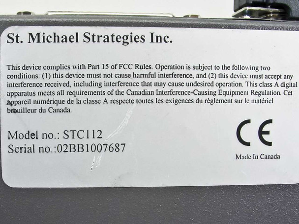 St. Michael Strategies STC112 bottom label showing model number STC112, serial number 02BB1007687, FCC and IC compliance text, CE mark, Made in Canada