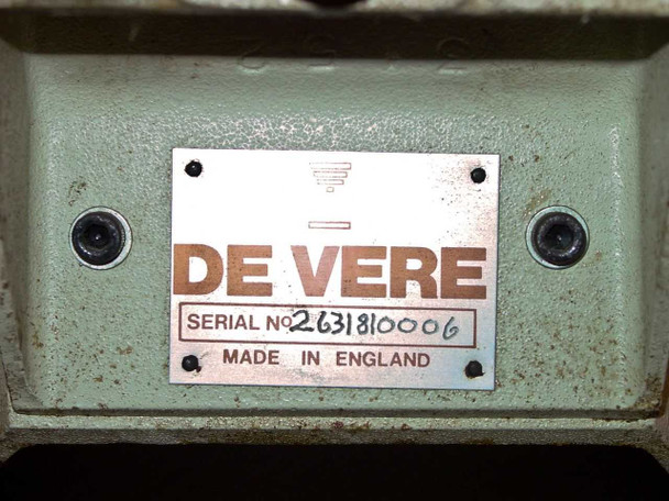 De Vere manufacturer nameplate showing Serial No. 2631810006 and Made in England on green-painted casting