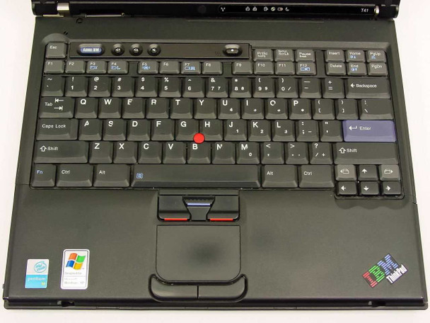 IBM ThinkPad T41 keyboard and TrackPoint close-up showing full keyboard layout and touchpad with Windows XP sticker