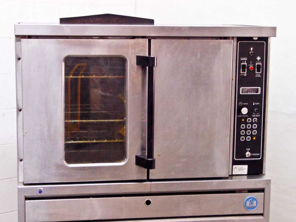US Range CG-100 convection oven front view from slightly lower angle showing door, window with racks visible inside, and full control panel on right side