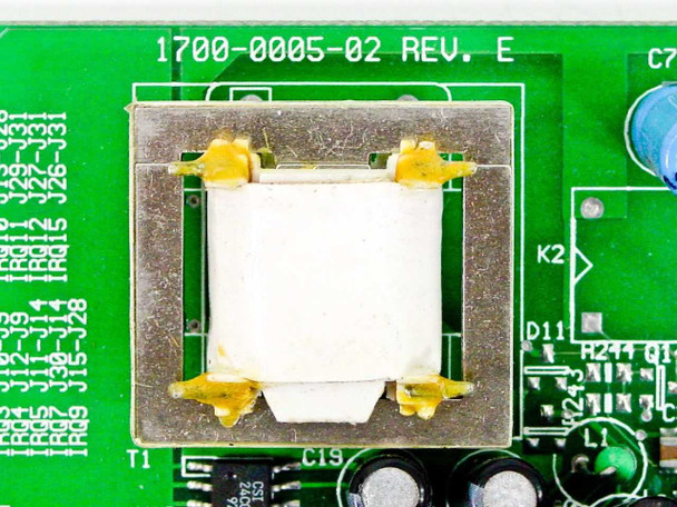 Rockwell 1700-0005-02 Rev E closeup — part number and revision silkscreen on PCB next to DAA transformer
