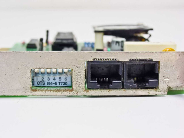 Omnitel T1200-PC4 ISA modem bracket close-up — dual RJ-11 connectors and 6-position DIP switch labeled CTS I94-6 T730