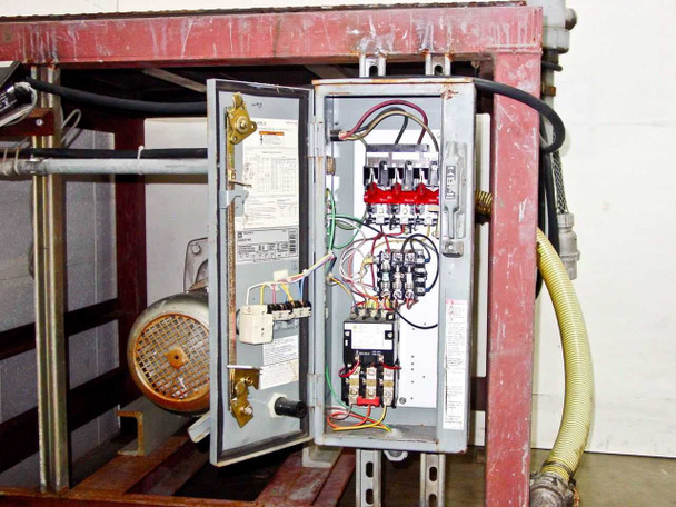Square D motor starter electrical enclosure open showing contactors, wiring, and control components
