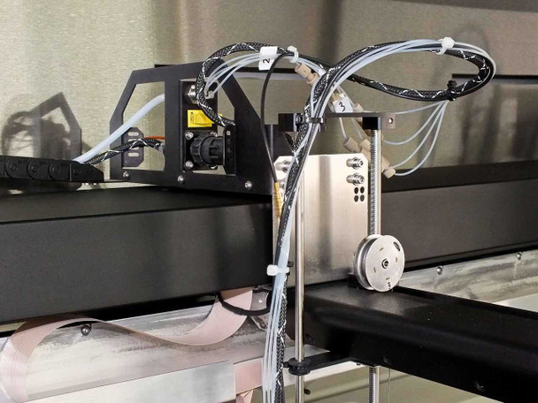 Symyx Technologies S14100 – close-up of robotic Z-axis arm assembly with Hitachi CCD camera, drive motor, and fluid tubing bundle
