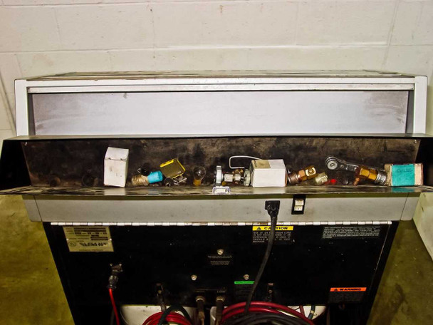 Sun Electric MRC 400 – top storage tray open showing assorted fittings, valves, and small parts; power cord and service hoses visible