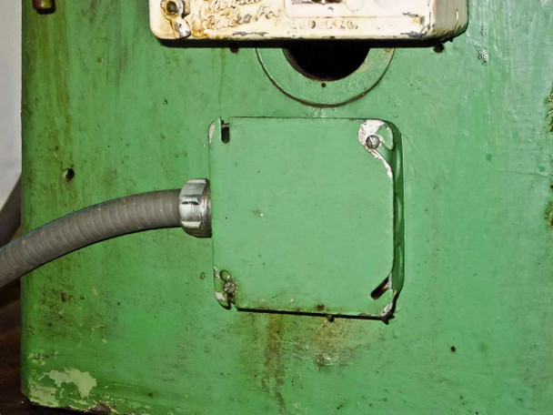Bothner WB15 side cabinet panel with conduit entry — green painted sheet metal with surface rust