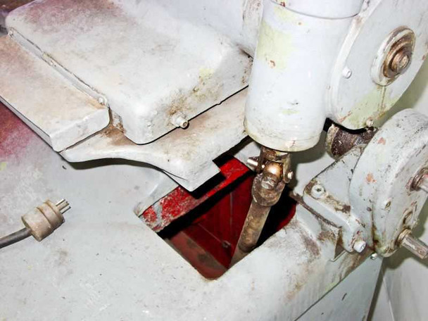 Top deck close-up showing polishing head mounting area, spindle, and red interior visible through access opening