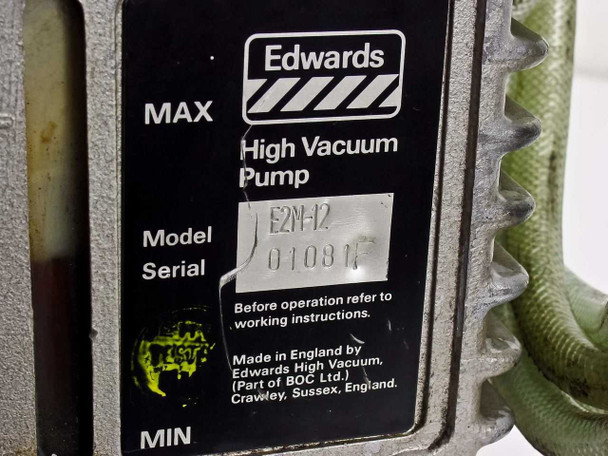 Edwards E2M12 pump body label – reading 'Edwards High Vacuum Pump, Model E2N-12, Made in England by Edwards High Vacuum (Part of BOC Ltd.), Crawley, Sussex, England'