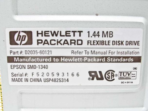 HP D2035-60121 label close-up showing Hewlett-Packard 1.44MB Flexible Disk Drive, part number, Epson SMD-1340, and DC +5V 1A rating