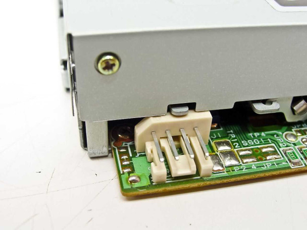 HP SMD-1340 floppy drive – close-up of 4-pin Berg power connector and PCB component detail