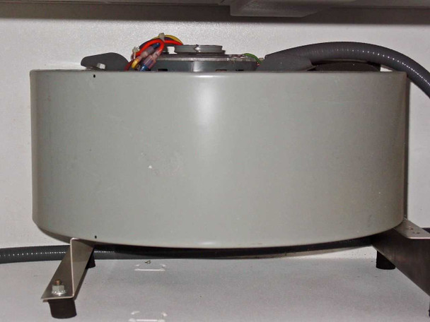 Close-up of centrifugal blower/fan motor showing motor housing, support bracket, and wiring harness