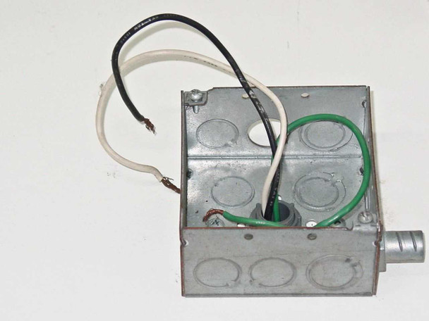 Close-up of top-mounted junction box showing incomplete wiring — bare wire ends (black, white, green ground) requiring termination