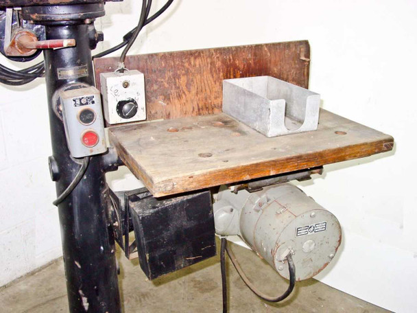 Bell and Howell Model D film printer stand three-quarter view showing work table, control panel with red and black buttons, and motor