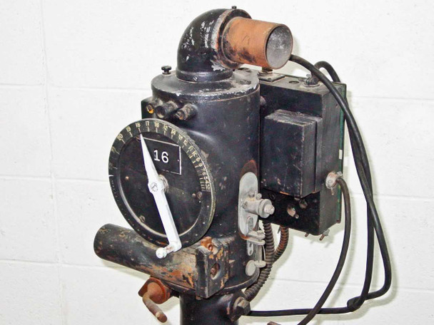 Close-up of printer head unit mounted on column showing dial indicator numbered to 16 and elbow light pipe fitting