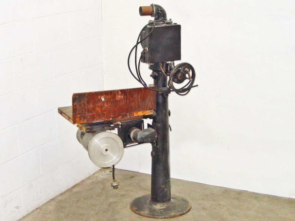 Bell and Howell Model D film printer stand full-length side profile view on round cast iron base showing printer head and work table