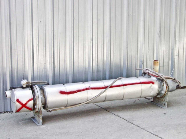 Shell and tube heat exchanger full side view — insulated shell with steel mounting feet, red spray-paint X mark, braided flex hoses attached at each end