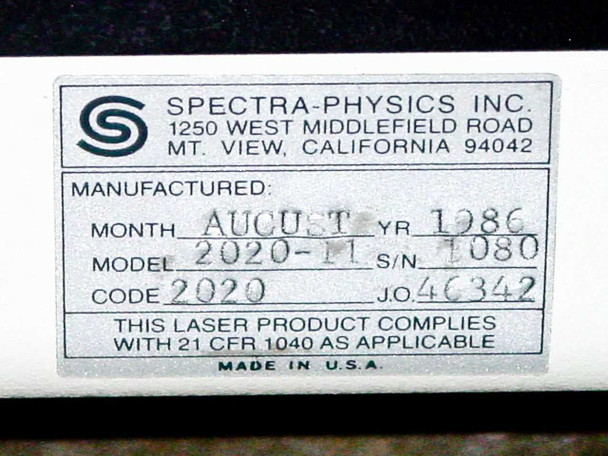 Spectra-Physics manufacturer label on laser head showing Model 2020-11, manufactured August 1986, S/N 1080, Code 2020, J.O. 46342, made in USA