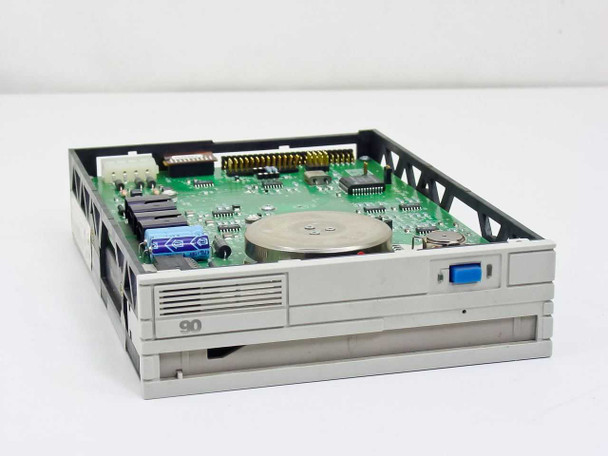 Iomega Beta 90B SCSI optical drive – angled top view showing PCB, spindle motor, and front bezel with '90' label