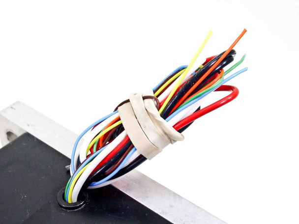 Close-up of multi-color flying wire leads on Emoteq QS05600-B02-H including red, white, black phase wires and Hall sensor wires