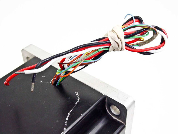 Emoteq QS05600 servo motor top view showing multi-conductor color-coded wire harness including red, black, white, and signal wires