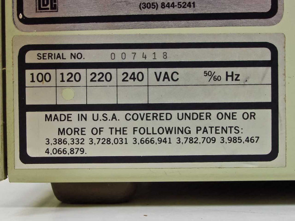 LDC ConstaMetric rating plate close-up showing SERIAL NO. 007418, voltage options 100/120/220/240 VAC 50/60 Hz, and MADE IN U.S.A. with patent numbers