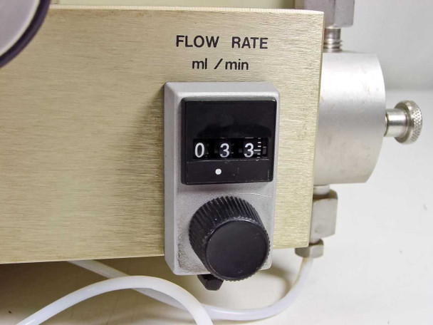 LDC ConstaMetric III G flow rate dial close-up showing mechanical odometer-style ml/min counter reading 0.33 and adjustment knob