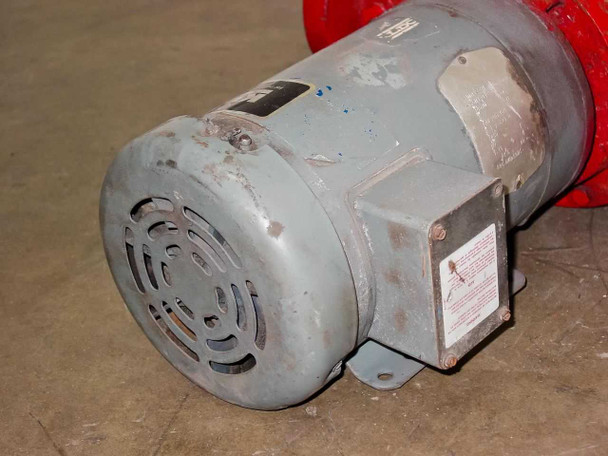 Baldor JMM3559T motor rear end view showing cooling fan shroud and junction box – gray motor housing with surface wear