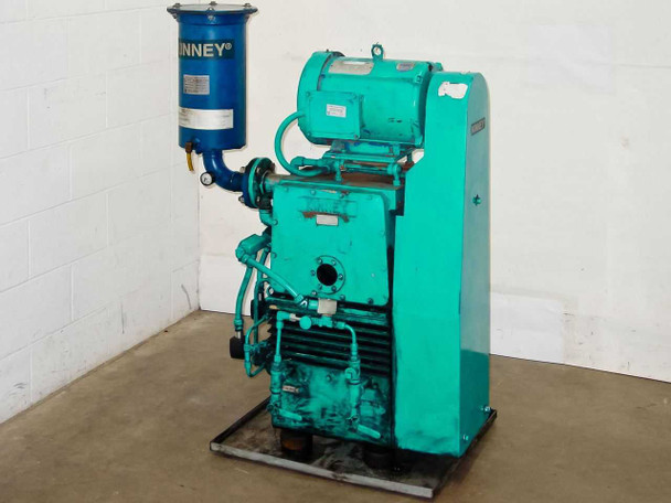 Kinney KTC112 high vacuum pump full unit front-left view — teal pump body with blue oil mist eliminator and Leeson motor on steel skid