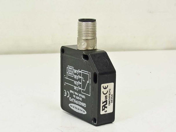 Banner QM42VP6LPQ photoelectric sensor — angled front-left view showing label with model number, CE and UL markings, and M12 connector on top