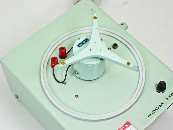 Mattson-Garvin Model 200 top view — rotating media platform with three-arm synchronous drive motor, 60-min indicator, sealing ring, and red electrical terminals