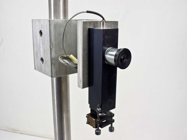 Bausch & Lomb optical stand — close-up of sliding optical holder with K 12mm lens and adjustable clamp assembly mounted on vertical column