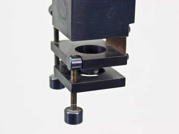 Bausch & Lomb optical stand — close-up of adjustable black anodized optical component clamp/holder with threaded adjustment screws and circular aperture