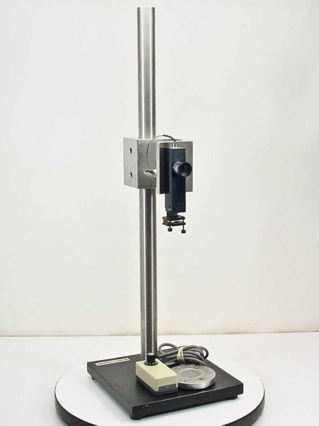 Bausch & Lomb standing optical platform full view — vertical stainless column, black base, optical holder and light source mounted, intensity controller on base