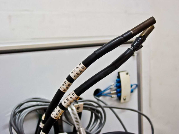 Heavy-duty DC output cables labeled TOP HEAD – cable ends with heat-shrink terminations