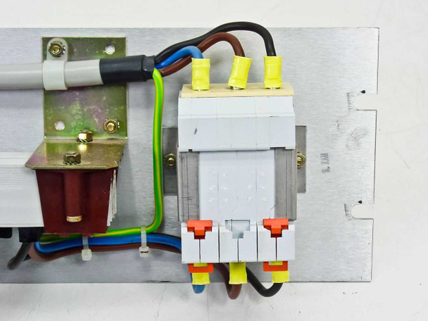 Rear panel detail showing contactor or three-pole breaker assembly with red and orange flag indicators, yellow wire ferrules on black and brown conductors, green/yellow earth wire