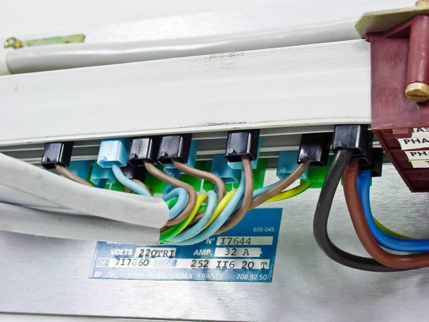 Rear interior view showing terminal block strip with multiple wire connections, blue rating plate partially visible confirming 220TRI 32A and Code 252 II6 20T, brown and blue phase wires