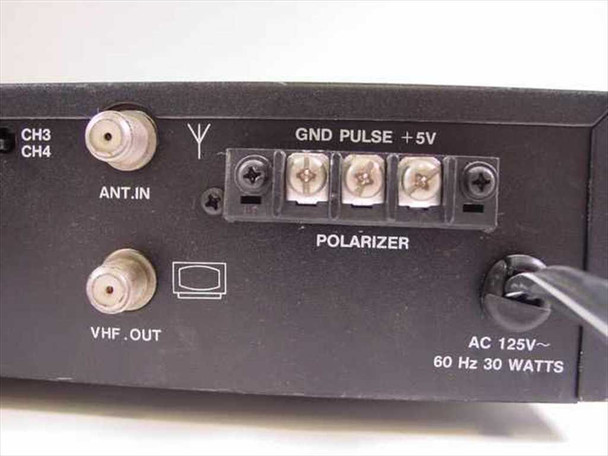 HI-MAXX RF-100 rear panel close-up showing ANT IN, VHF OUT F-connectors, GND/PULSE/+5V polarizer terminal block, and AC 125V 60Hz 30W rating label