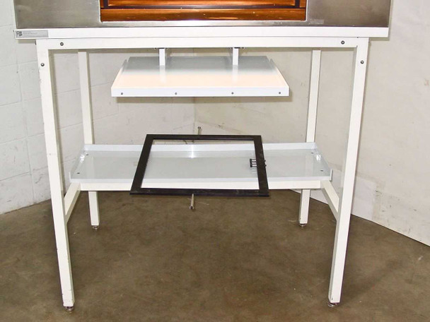 White metal table stand for CRP L-207-B chamber showing two shelf levels and black-framed 22x22" plate holder resting on lower shelf